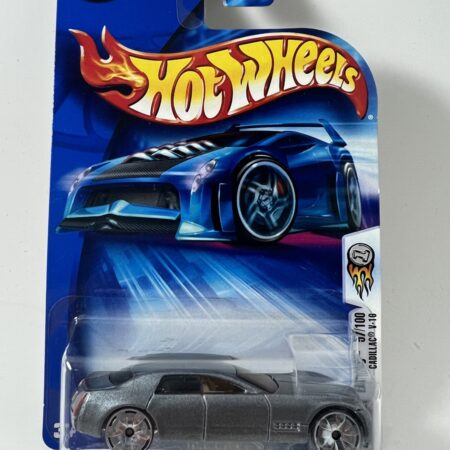 hot wheels 1:64 diecast car in packaging blue card front view silver sports car collectible