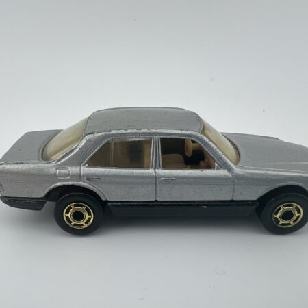 silver sedan diecast car with gold wheels side view right profile vintage toy