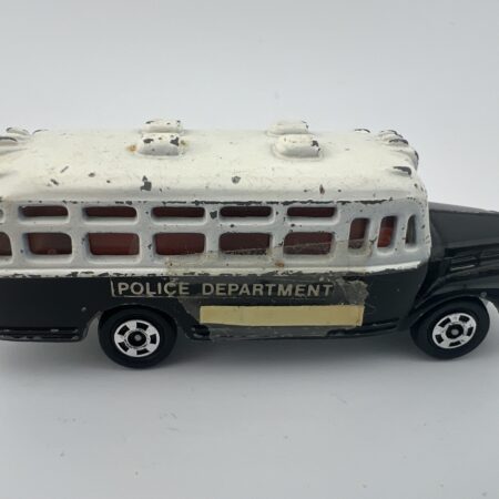 black and white police bus diecast vehicle side view left profile vintage toy