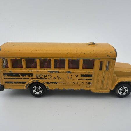 yellow school bus diecast vehicle vintage toy side view left profile worn condition