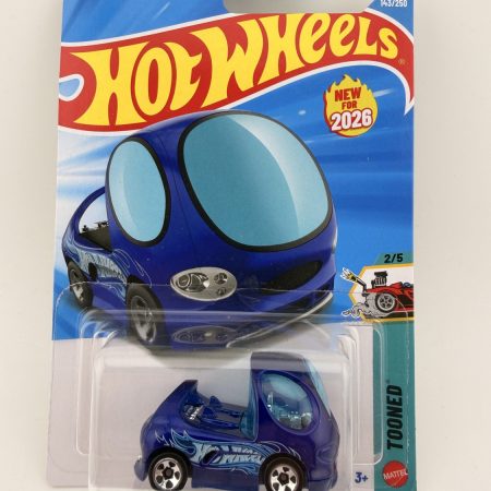 Hot Wheels Deora Tooned diecast car in original packaging with colorful artwork and Mattel branding, 1:64 scale collectible