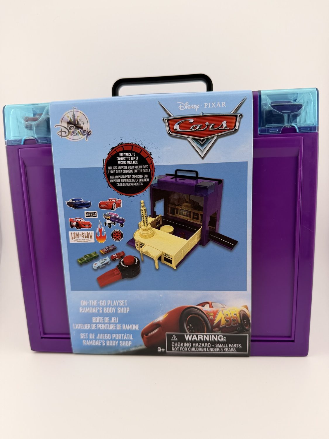 Disney Pixar Cars Ramone’s Body Shop portable playset with Lightning McQueen and accessories. Opens into full display scene.